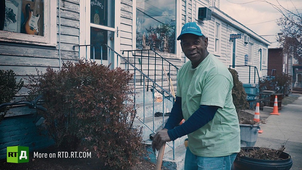 Bruce Stewart, an African American father, in front of a clapboard house. Still taken from RTD documentary, Black Lives 10: Trap.
