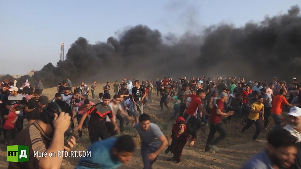 During Gaza's Matrch of Return, Palestinians run away from black smoke. Still taken from RTD documentary Palestine in Seeking Recognition series.