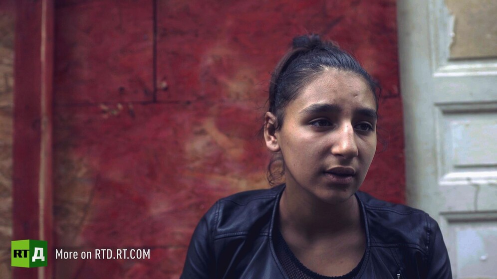 Roma teenage girl in Northern Paris shanty town. Still taken from RTD documentary Tolerance du Voyage.