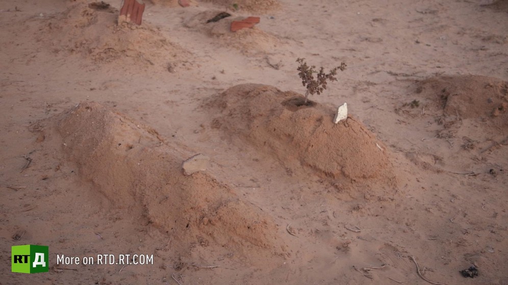 Two graves in Chamseddine Marzoug's cemetery of the unknown, Tunisia. Still taken from RTD documentary Fisher of Men.