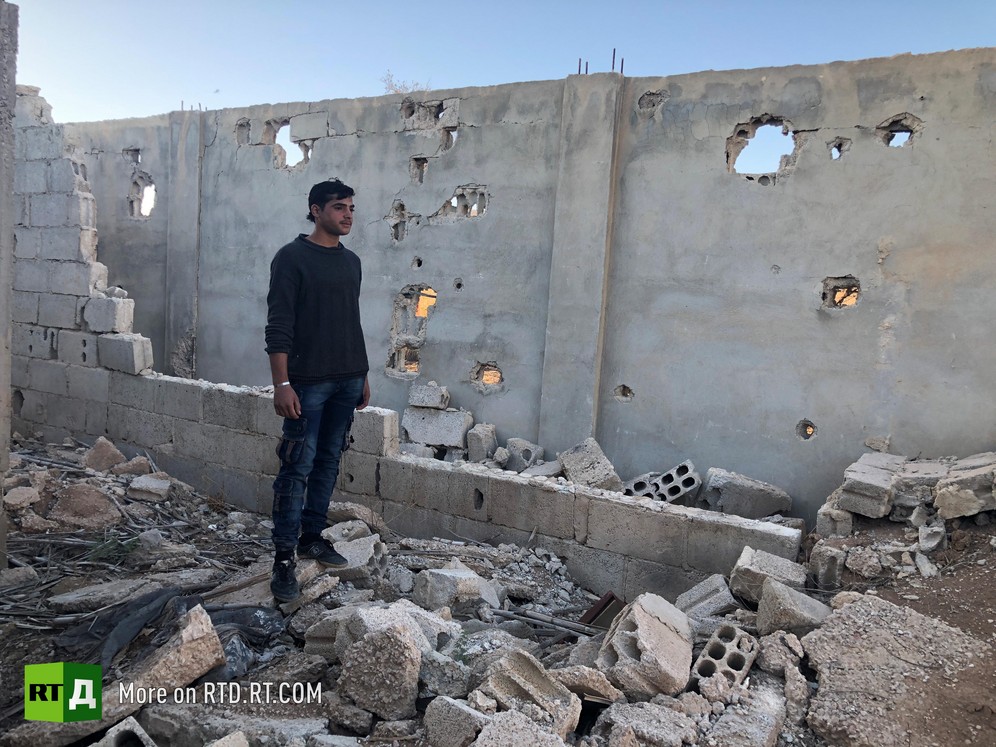 'We watched them from here. If they advanced, we fired back'. Imad, a former child soldier, shows an RTD film crew the hideout where he was taken to monitor the Syrian Army for terrorist militants.