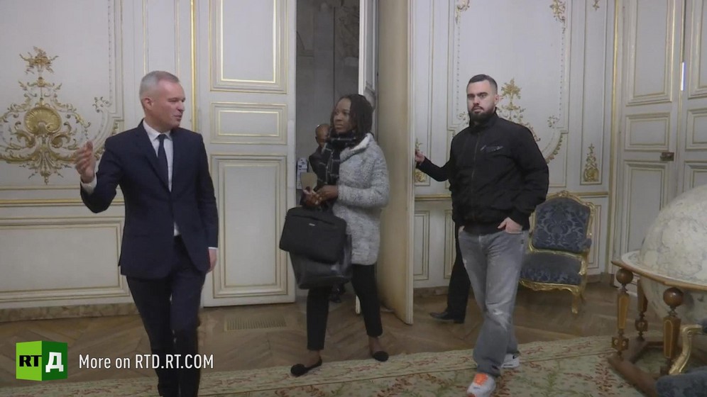 French Environment minister Francois de Rugy shows Yellow Vest spokespeople Priscillia Ludosky and Eric drouet into a ministry room. Still taken from RTD documentary Yellow Vest Fever.