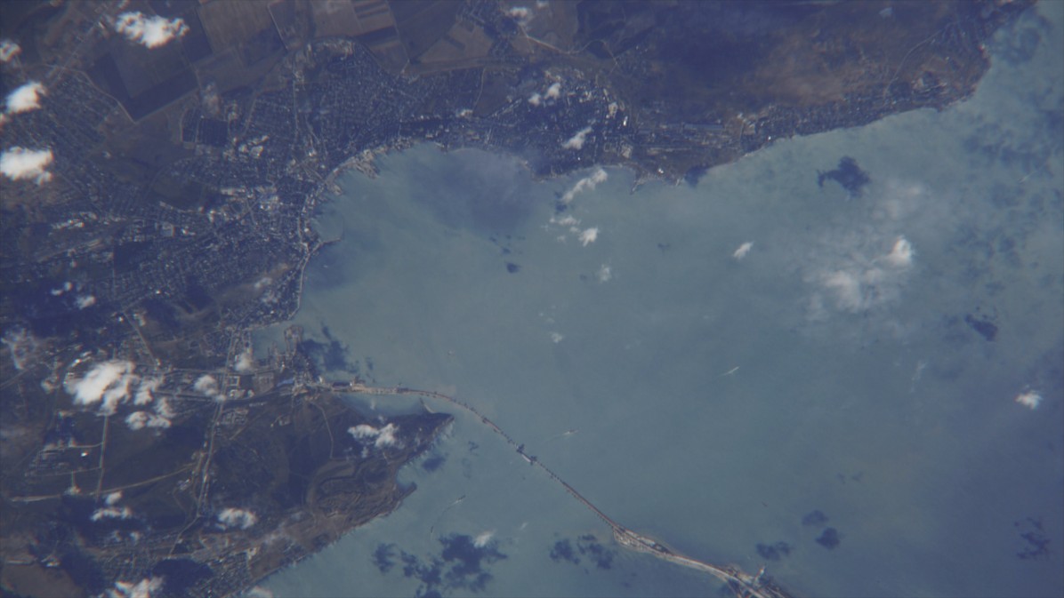 A photo of the Crimean Bridge and the Kerch Strait taken by Russian cosmonaut Sergey Ryazansky from the International Space Station. © A still from the documentary film The Bridge.
