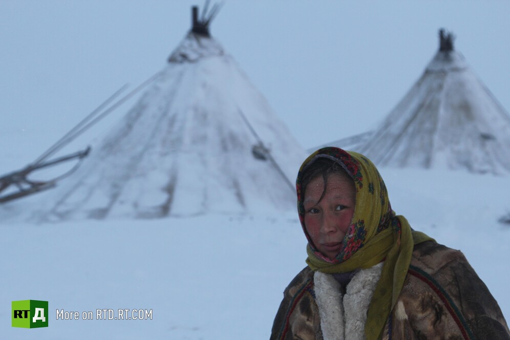 A Nenets woman in front of the chum 