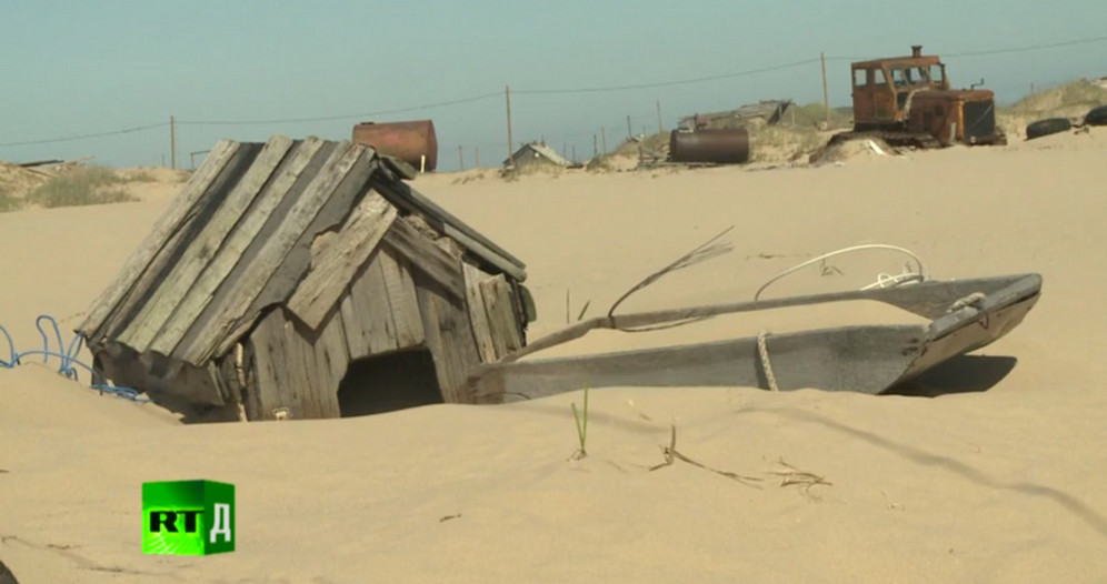 Deep-sea trawling has wiped out all sea bed vegetation causing a build-up of thousands of tons of sand, which is blown on to the land by powerful arctic winds, obliterating houses and buildings. A still from Mysterious Sands of Russia / RTD