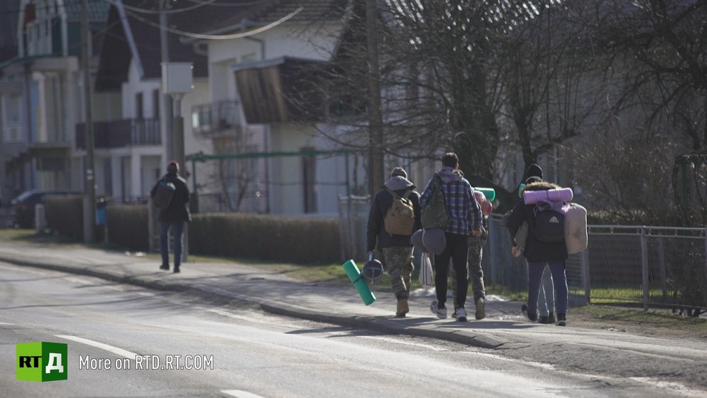 Migrants cross the border between Bosnia and Croatia