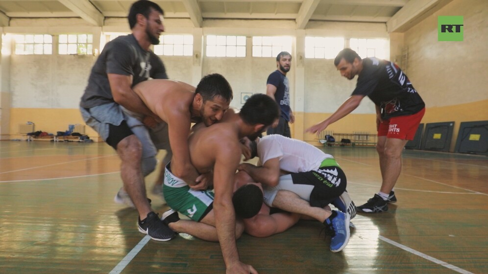 Scrum during Eagles of Dagestan MMA training camp. Still taken from RT Sport documentary Dagestan: land of Warriors, Episode 2.