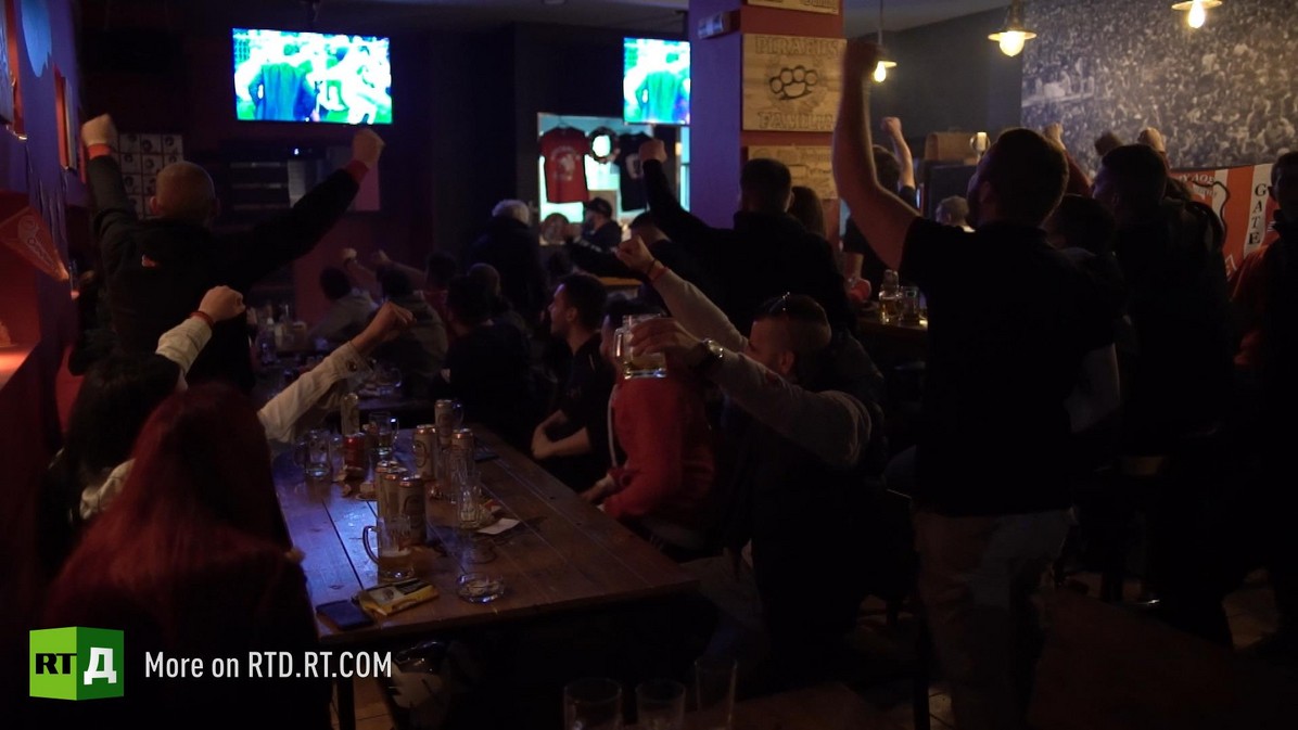 Football hooligans meet in their own private club before an important match