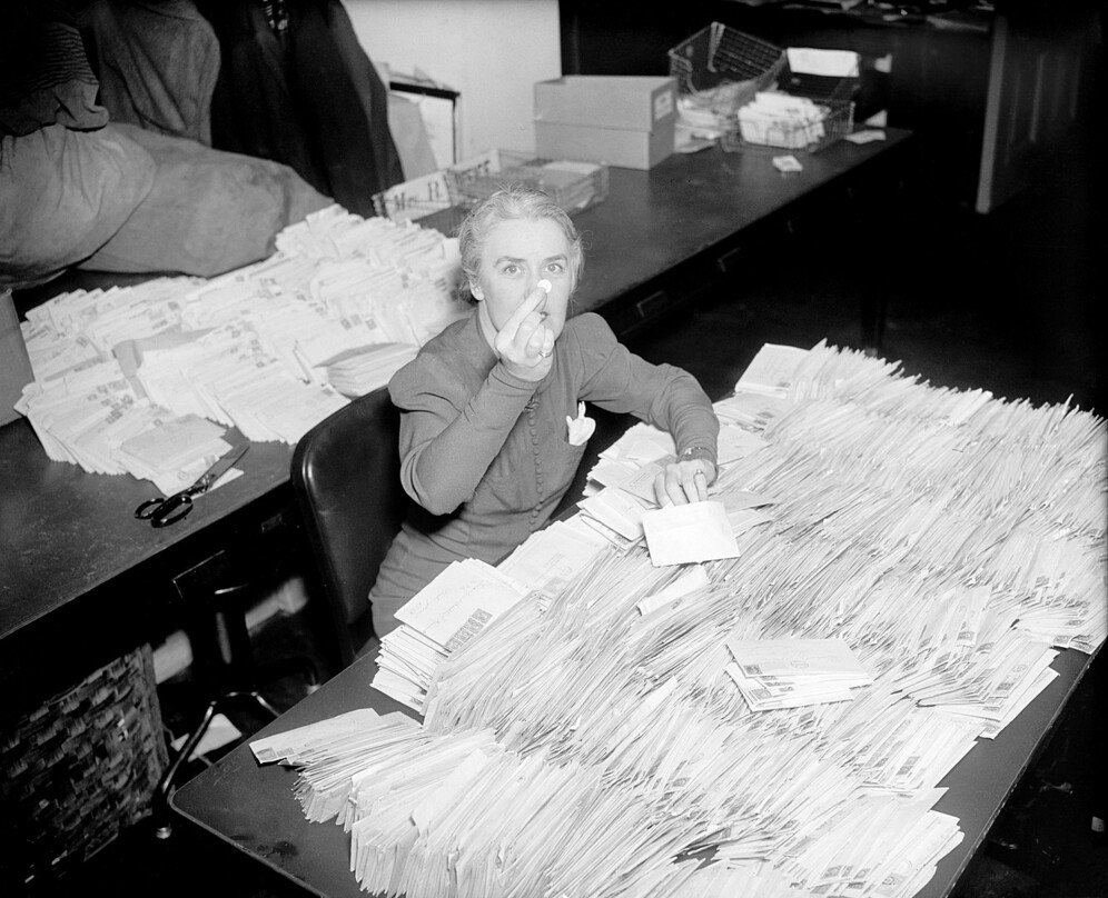 FDR's secretary with 30,000 letters containing ten-cent contributions to the National Foundation for Infantile Paralysis