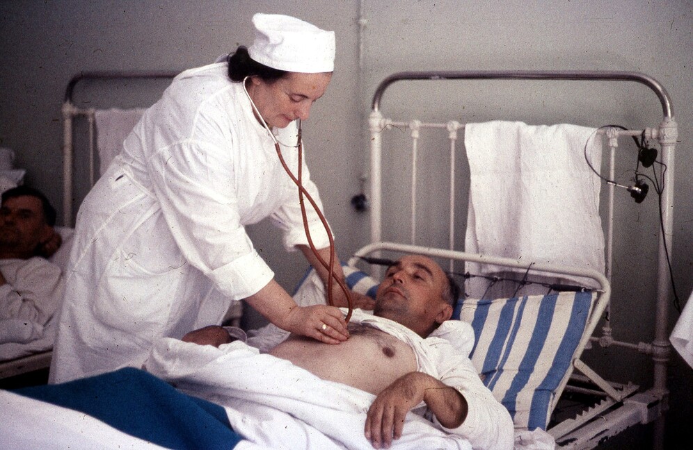 A nurse treating a patient in a hospital