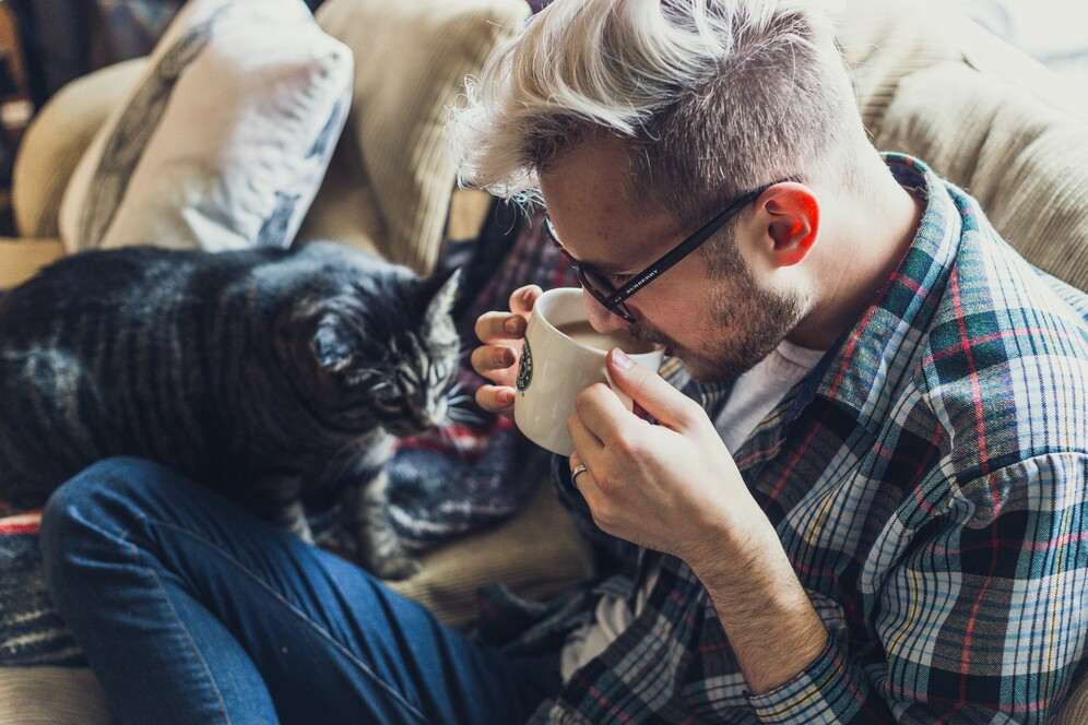 guy chilling with cat