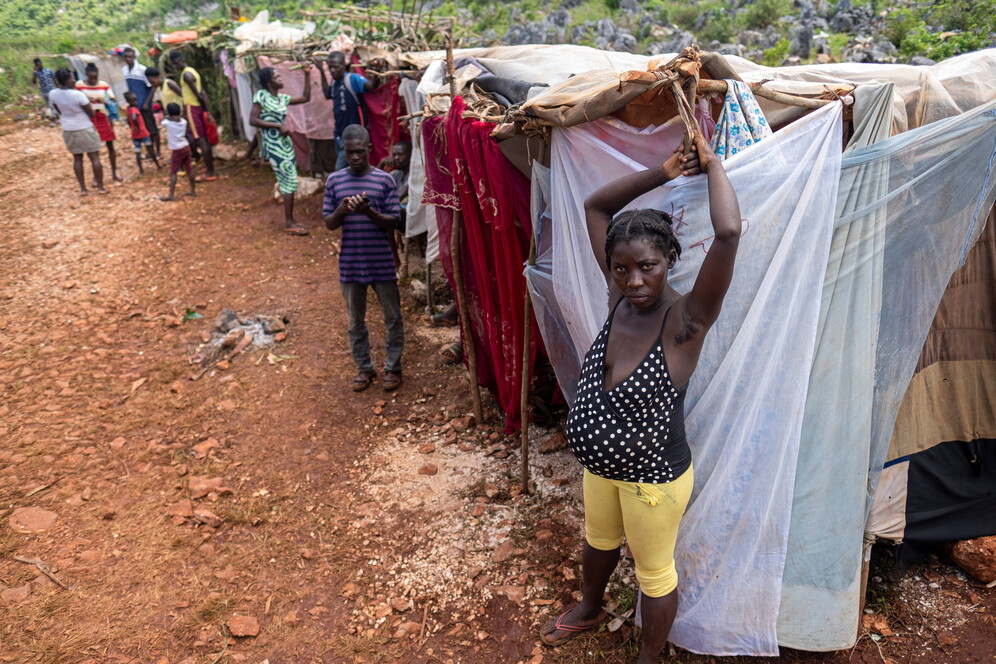 People stay in makeshift tents at a camp after the 7.2 magnitude quake on August 14 damaged or destroyed their houses in the Nan Konsey neighbourhood in Haiti