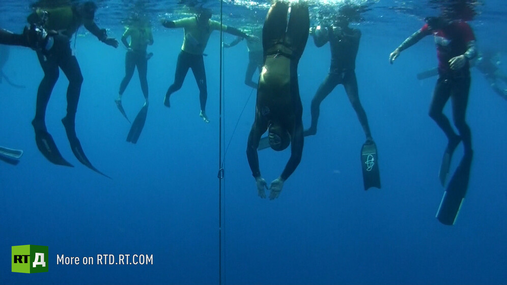 Team of freedivers underwater. Still taken from RTD documentary Dying to Dive.